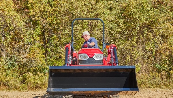 Front loader view of a Massey Ferguson 1E Series compact tractor with FLx2407 loader attachment – for sale at USA Equipment, New Iberia, Louisiana.